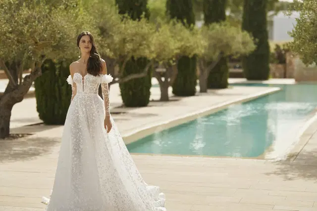 Sheila by Adriana Alier: Ball Gown silhouette, sweetheart neckline, long sleeves, lace