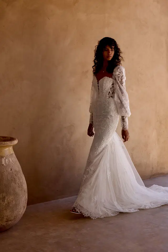 66451 by Lillian West: Trumpet silhouette, sweetheart neckline, long sleeves, lace