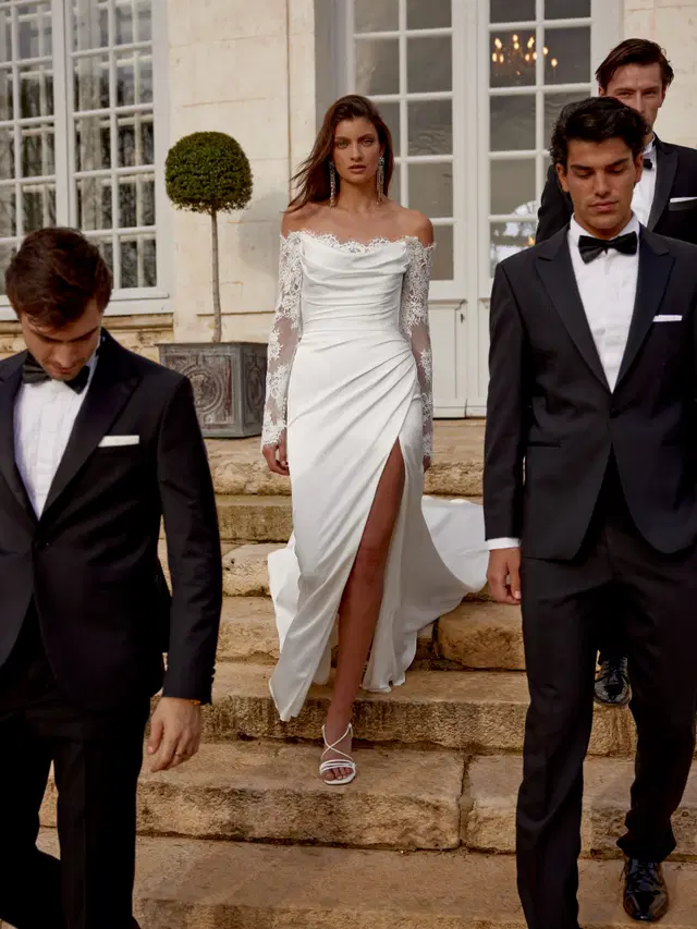 Jessa by Justin Alexander: Fit & Flare silhouette, off-shoulder neckline, long sleeves, lace