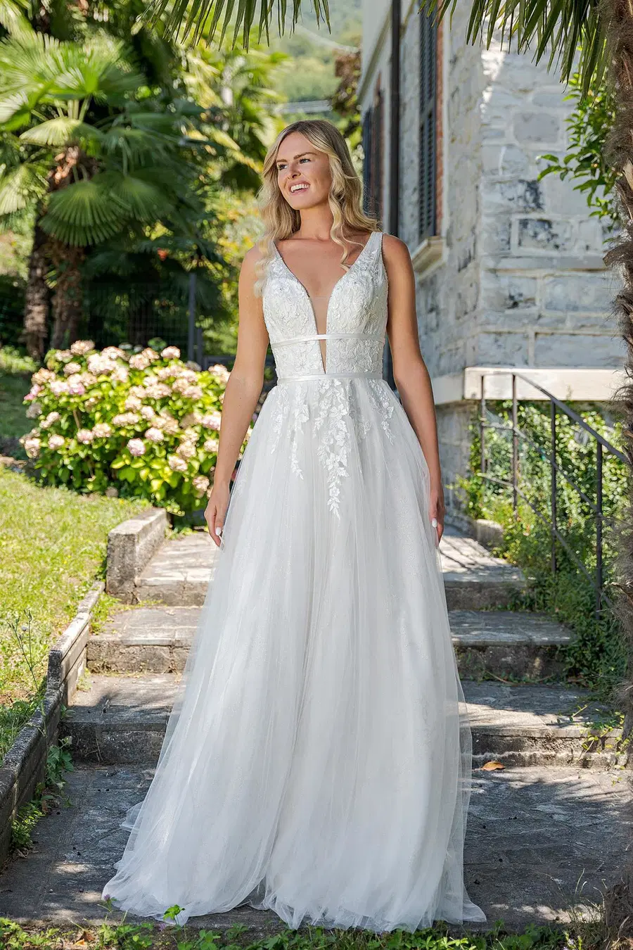 VN17 ivory by Vera Nova: A-Line silhouette, V-neck neckline, sweep / brush train
