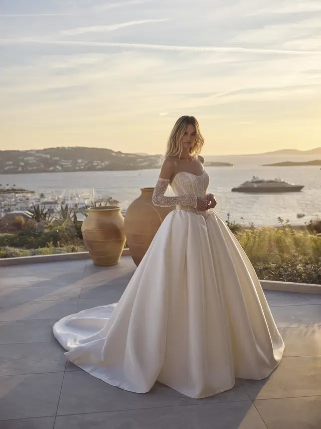 Imke by Modeca Bridal: Ball Gown silhouette, scoop neckline, mikado, cathedral train