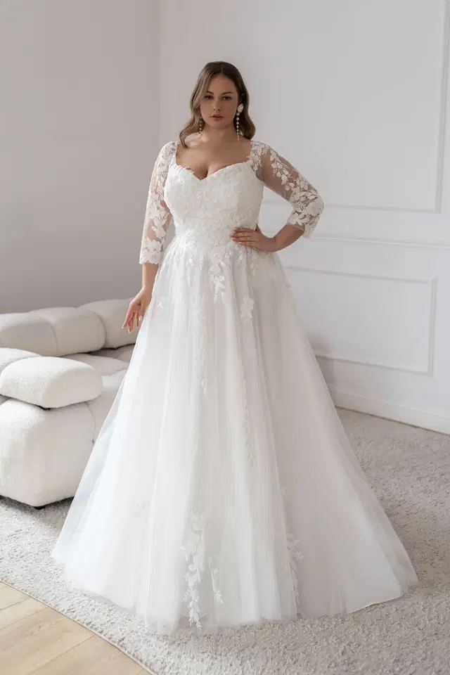 Girona by Jarice: A-Line silhouette, semi sweetheart neckline, three-quarter sleeves, tulle