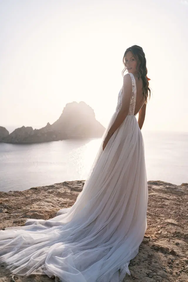 Cinta by Malee: A-Line silhouette, deep V-neck neckline, lace, cathedral train