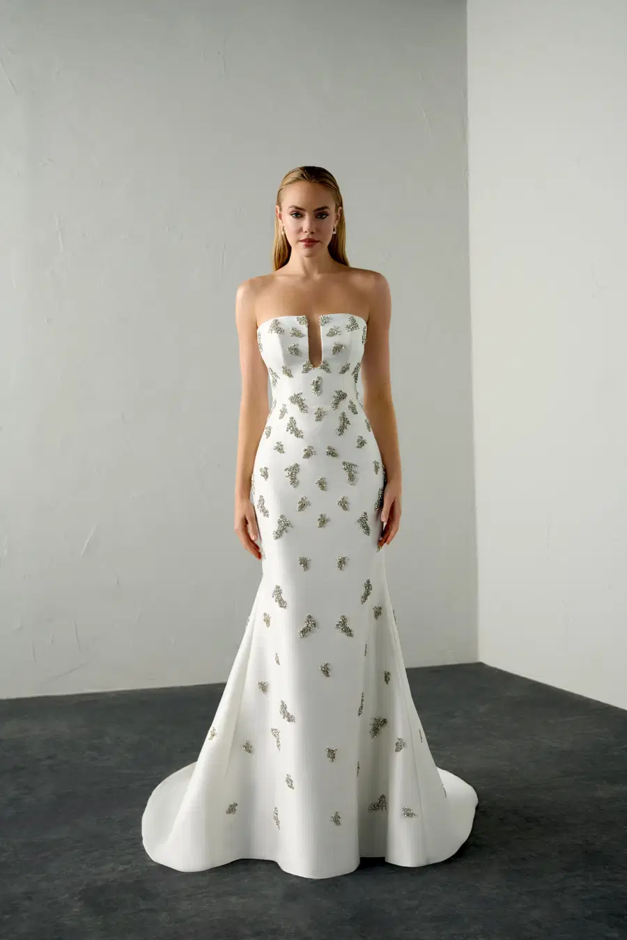 Vice by Justin Alexander Signature: Trumpet silhouette, deep V-neck neckline, sleeveless