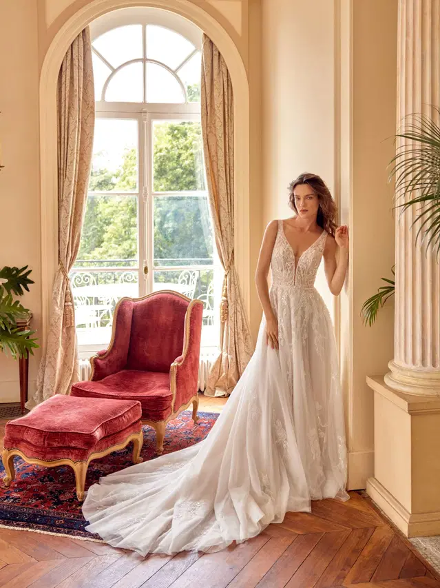 Melina by Justin Alexander: Trumpet silhouette, deep V-neck neckline, sleeveless, lace