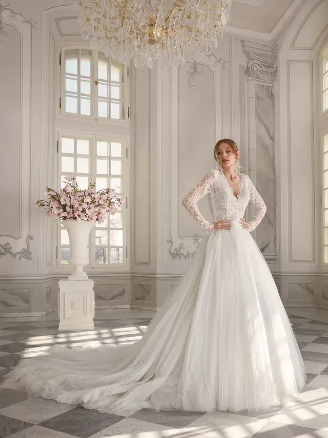 Nina by Vanilla Sposa: Ball Gown silhouette, V-neck neckline, long sleeves, lace