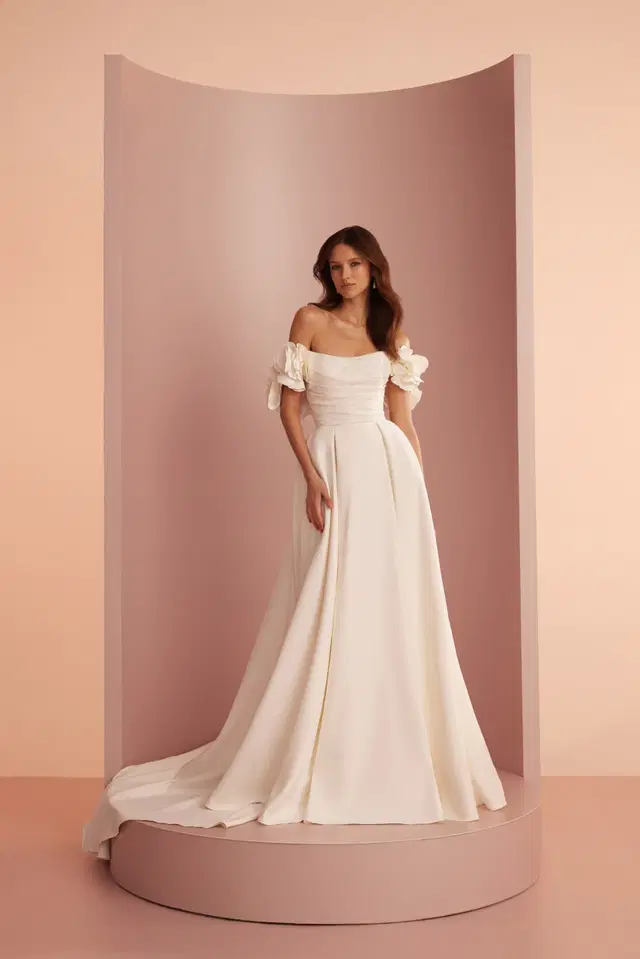 L402 by Ariamo Light: A-Line silhouette, sweetheart neckline, short sleeves, satin