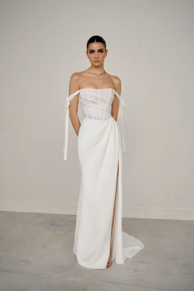 Cadenza by Justin Alexander Signature: Fit & Flare silhouette, cat eye neckline, crepe
