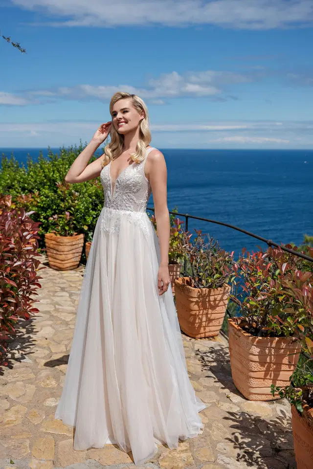 DT307 by Duett: A-Line silhouette, deep V-neck neckline, sleeveless, tulle
