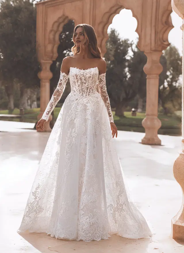 Vanessa by Enzoani: A-Line silhouette, scoop neckline, long sleeves, lace