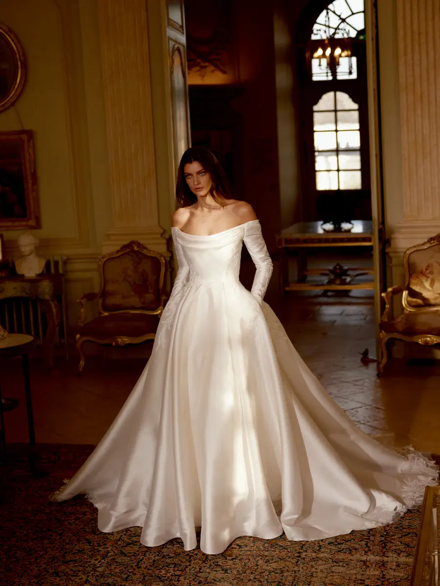 Josephine by Justin Alexander: A-Line silhouette, off-shoulder neckline, long sleeves, lace