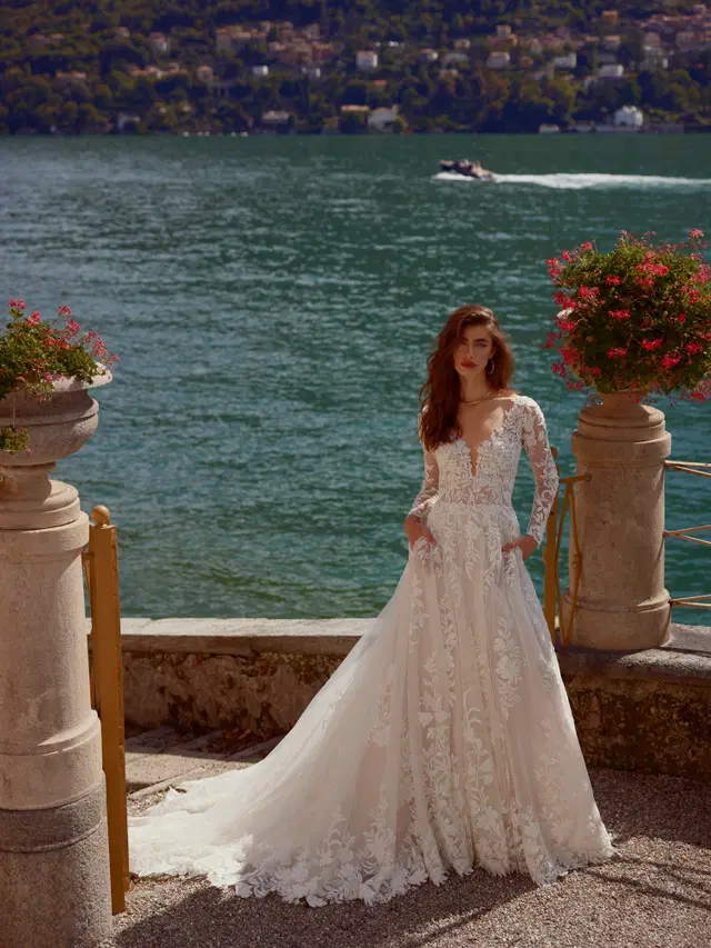 Isley by Justin Alexander: A-Line silhouette, V-neck neckline, long sleeves, lace