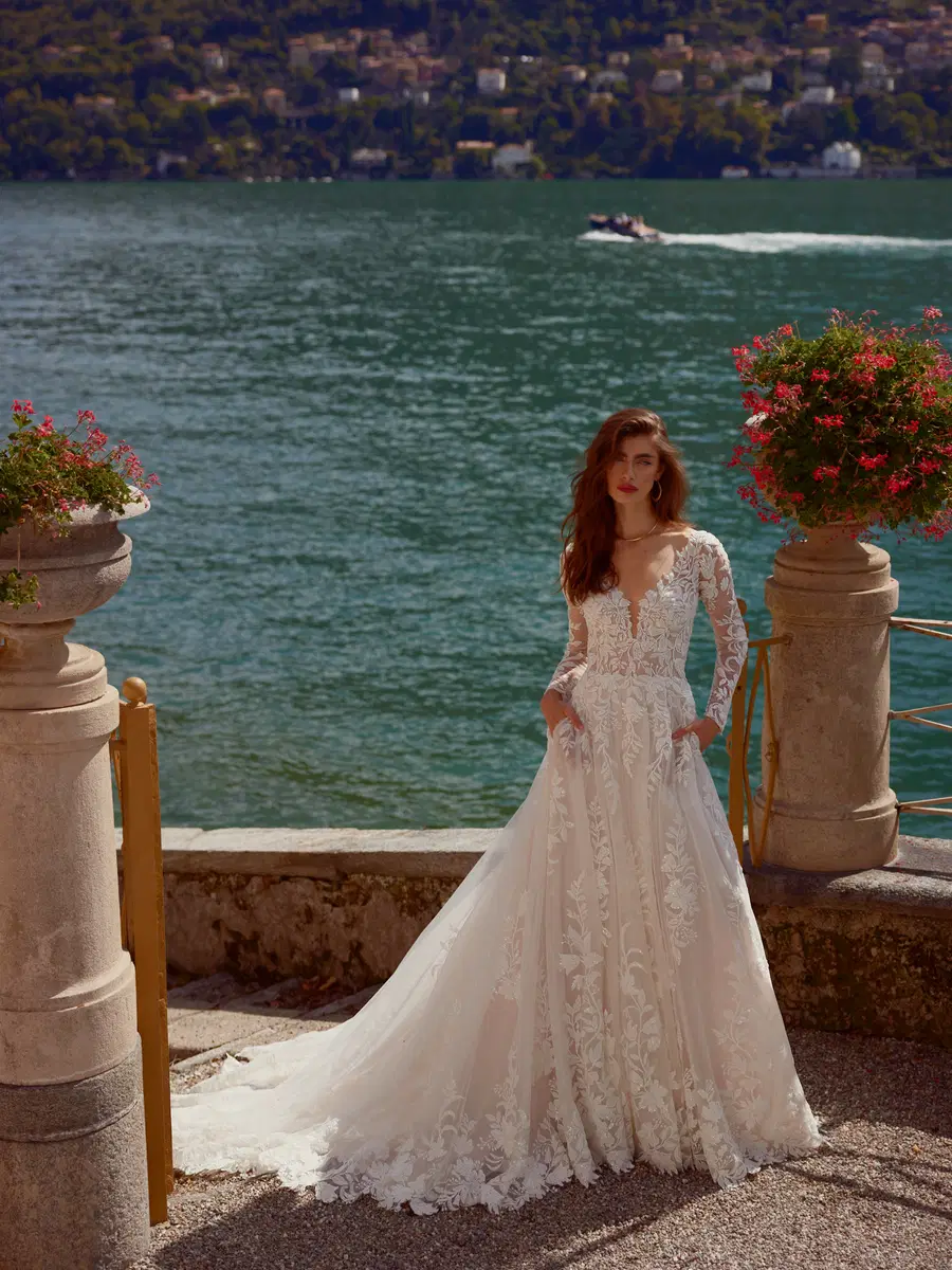 Isley by Justin Alexander: A-Line silhouette, V-neck neckline, long sleeves, lace