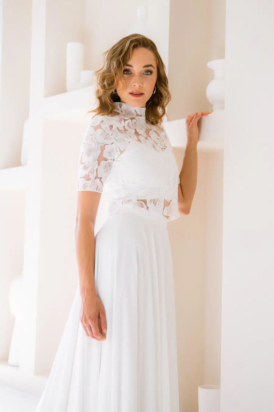 Top Cales by noni Selected: Two-Piece silhouette, high / halter neckline, short sleeves, polyester
