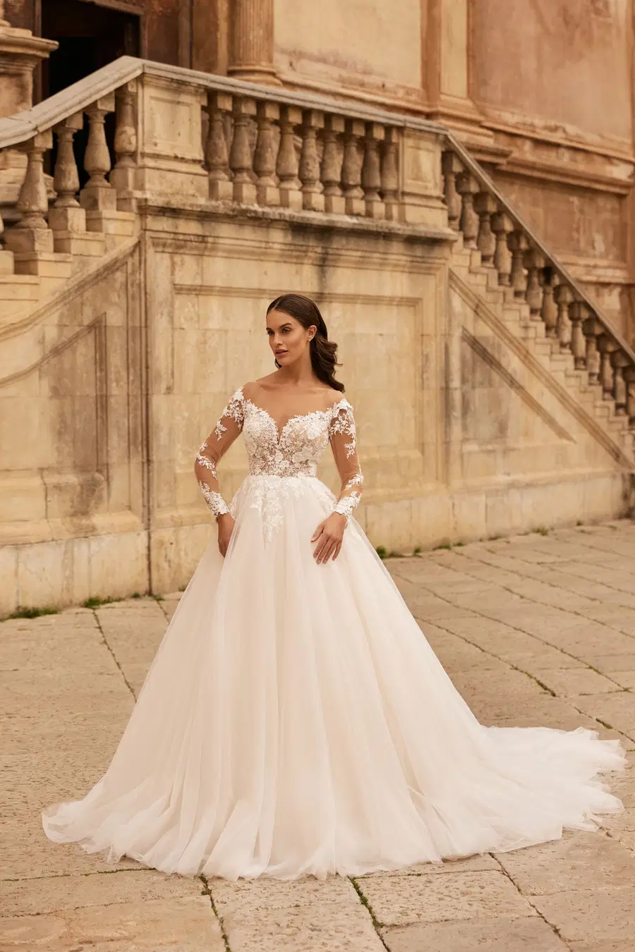 8324 by Monica Loretti: Ball Gown silhouette, off-shoulder neckline, long sleeves, tulle