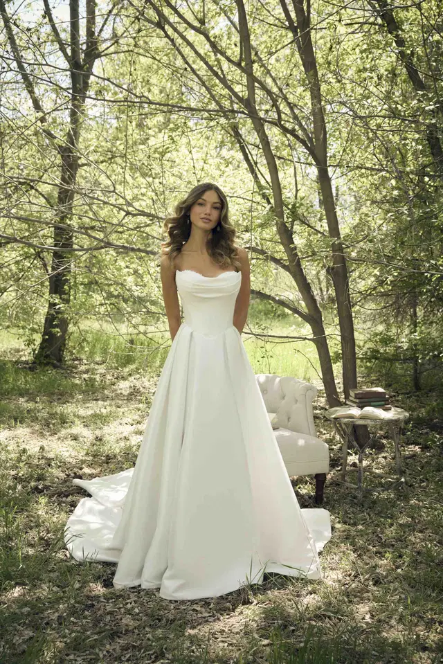 JOANIE by Rebecca Ingram: A-Line silhouette, cat eye neckline, cap sleeves, satin