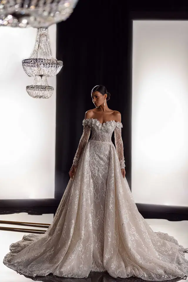 Violante by Tina Valerdi: Mermaid silhouette, off-shoulder neckline, long sleeves, tulle