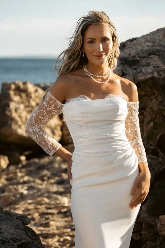 Dahshina by Amo & Luv: Trumpet silhouette, straight neckline, long sleeves, satin