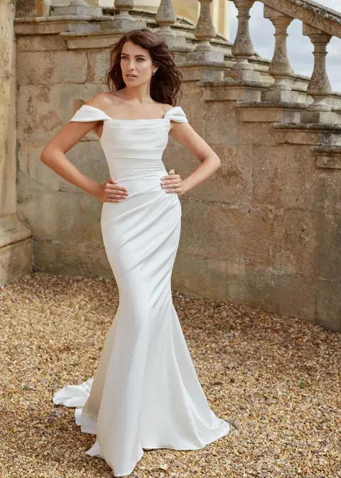 Demure wedding dress by Dando London, trumpet, satin