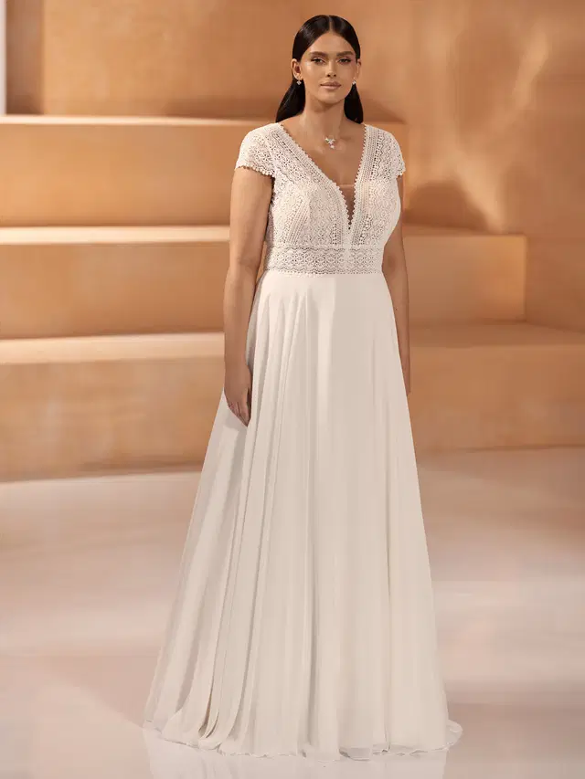 NORMA c by Bianco Evento: A-Line silhouette, deep V-neck neckline, cap sleeves, lace