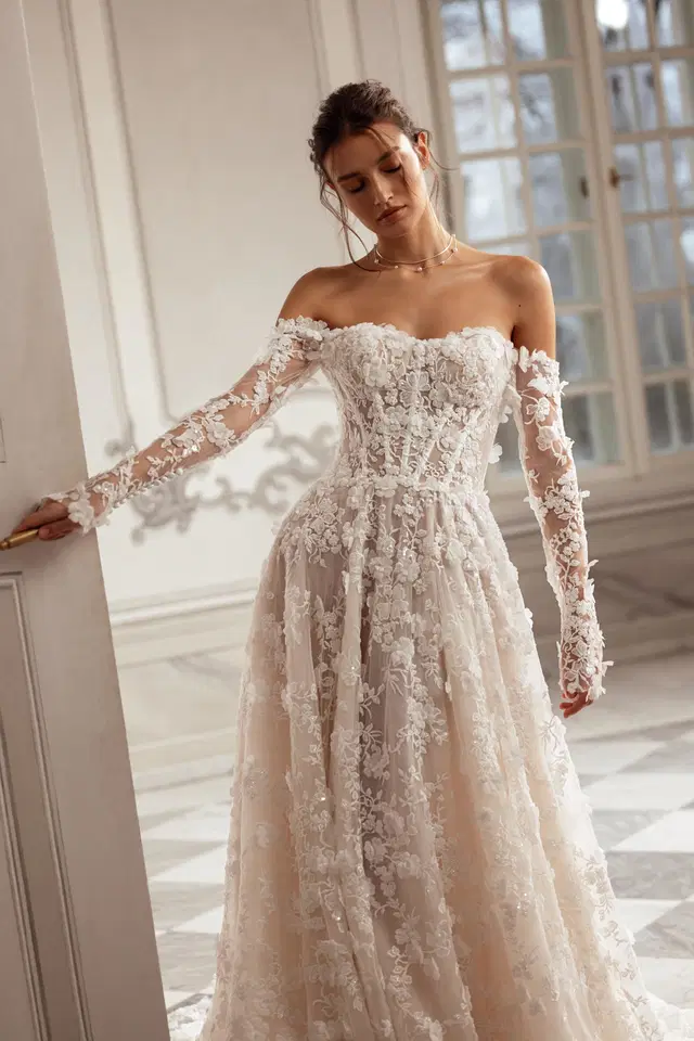 Sylvie by Tina Valerdi: A-Line silhouette, sweetheart neckline, long sleeves, lace