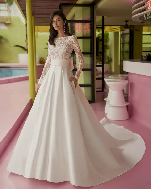 Jorine by Luna Novias: A-Line silhouette, boat neck neckline, long sleeves, lace