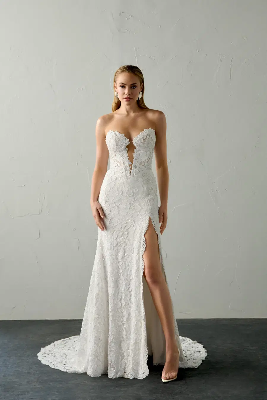 Blaze by Justin Alexander Signature: Trumpet silhouette, deep V-neck neckline, sleeveless, lace