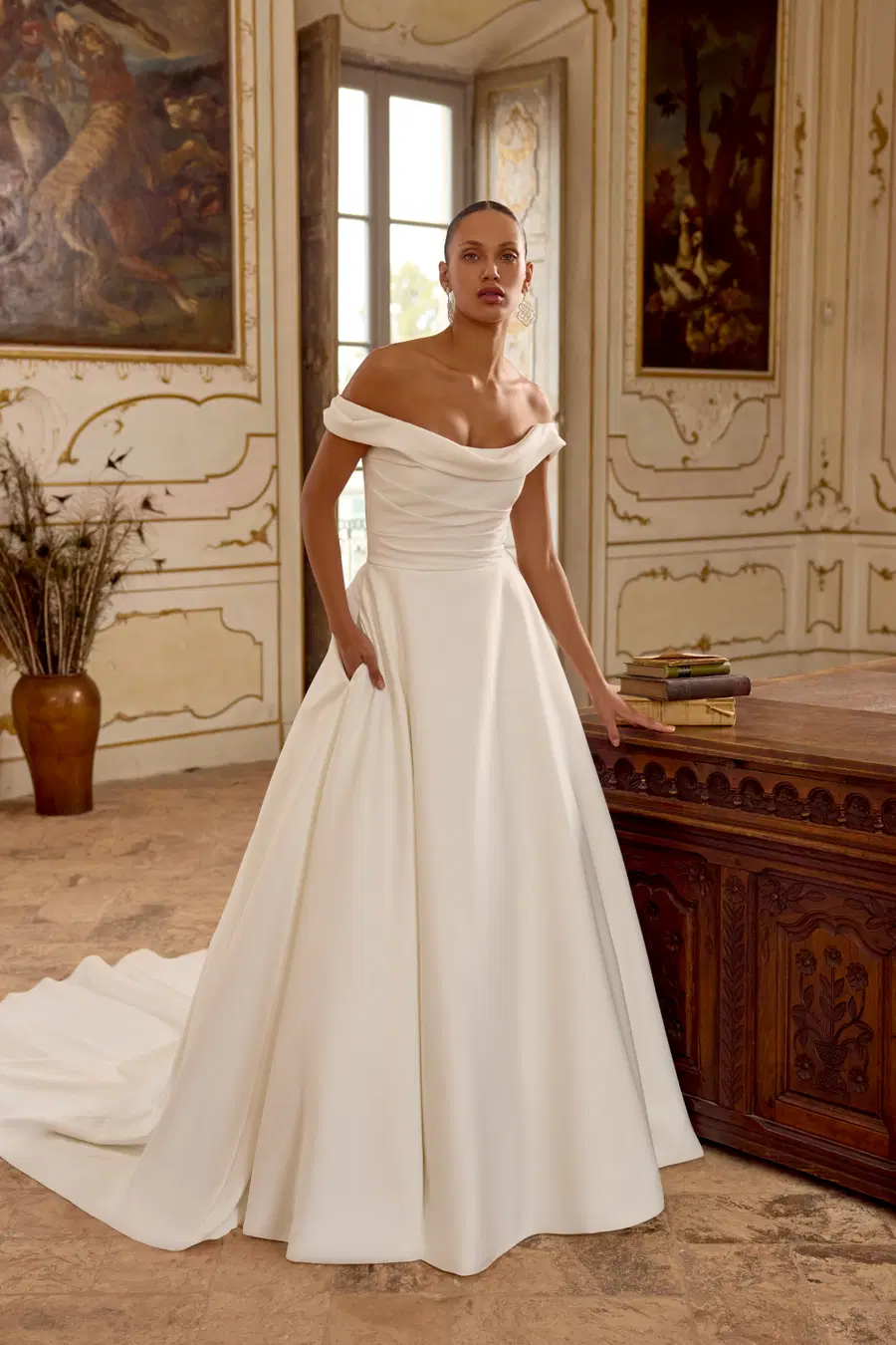 Kelly by Justin Alexander: A-Line silhouette, off-shoulder neckline, satin