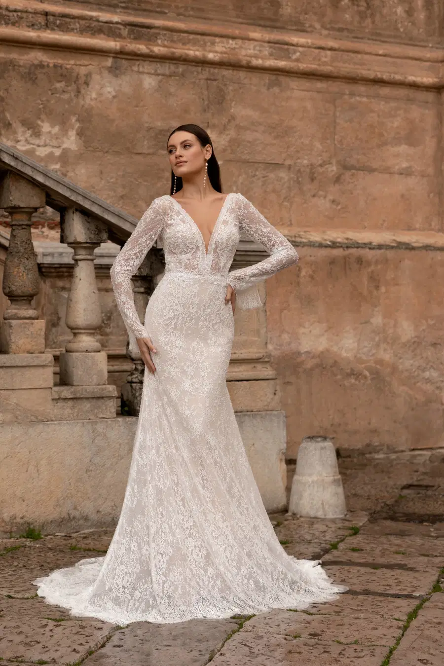 8328 by Monica Loretti: Fit & Flare silhouette, deep V-neck neckline, long sleeves, lace