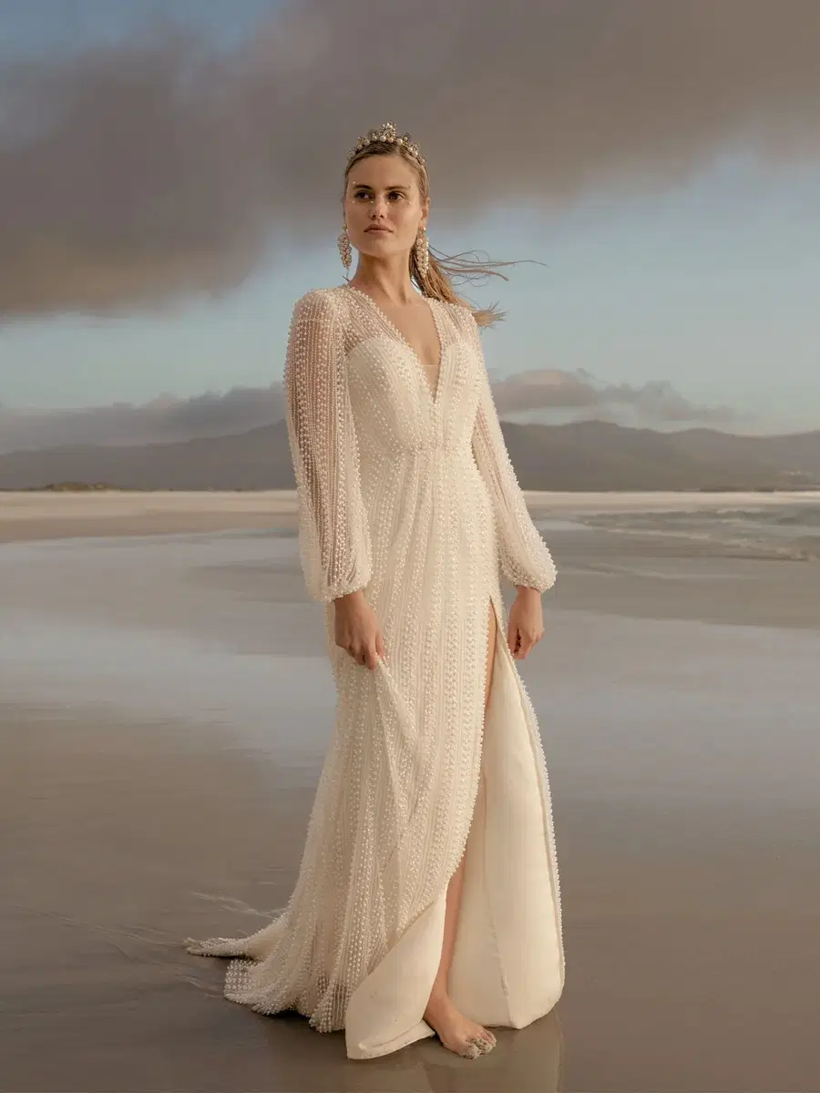Belle Gown by Catherine Deane: Trumpet silhouette, deep V-neck neckline, long sleeves, tulle