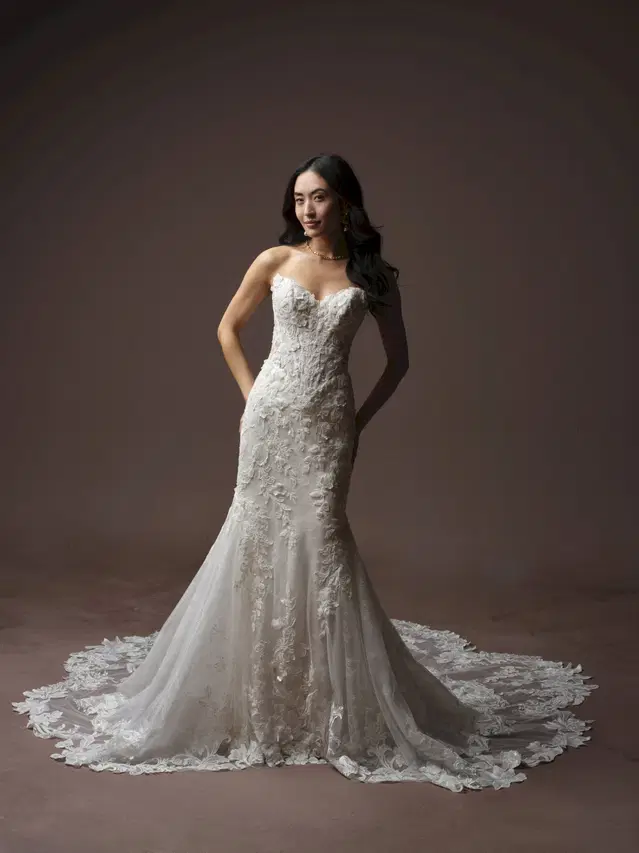 ESTELLE by Maggie Sottero: Fit & Flare silhouette, cat eye neckline, cap sleeves, lace