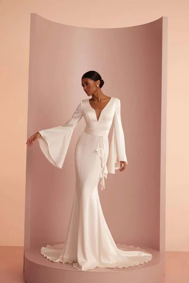 L420 by Ariamo Light: Trumpet silhouette, deep V-neck neckline, bell sleeves, satin