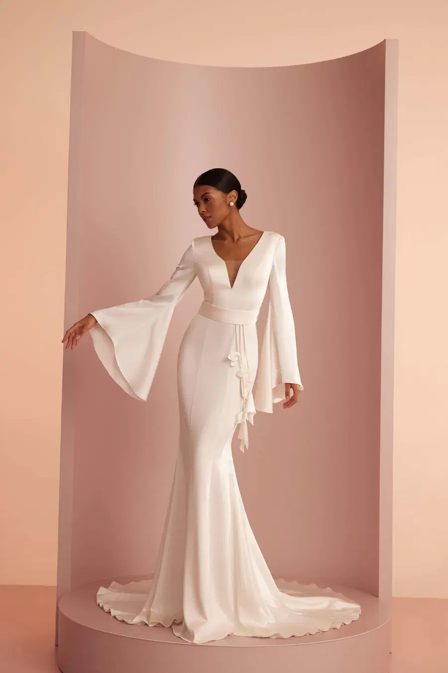 L420 by Ariamo Light: Trumpet silhouette, deep V-neck neckline, bell sleeves, satin