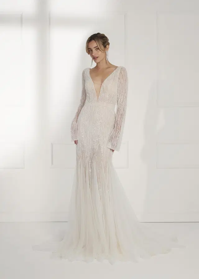 VIDA by Serravalle: Trumpet silhouette, deep V-neck neckline, long sleeves, embroidery