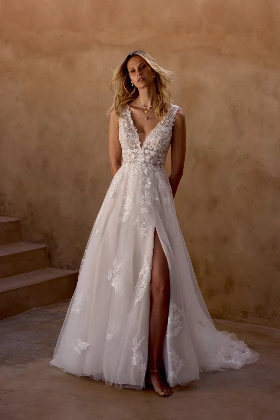 66464 by Lillian West: Trumpet silhouette, deep V-neck neckline, sleeveless, tulle