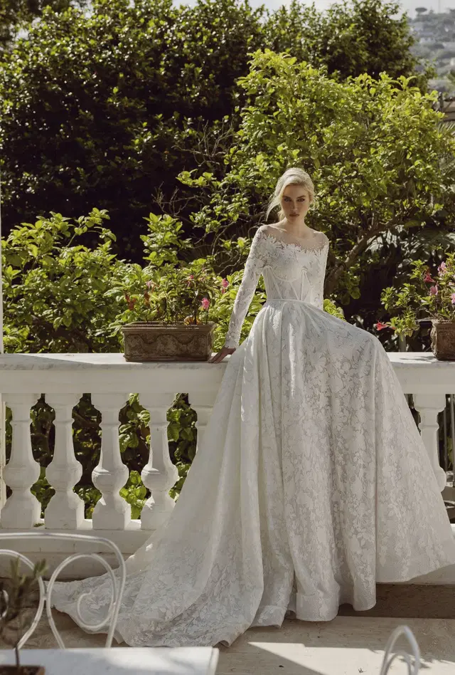 Emilia 24-010 by Ricca Sposa: Ball Gown silhouette, illusion neckline, long sleeves, lace
