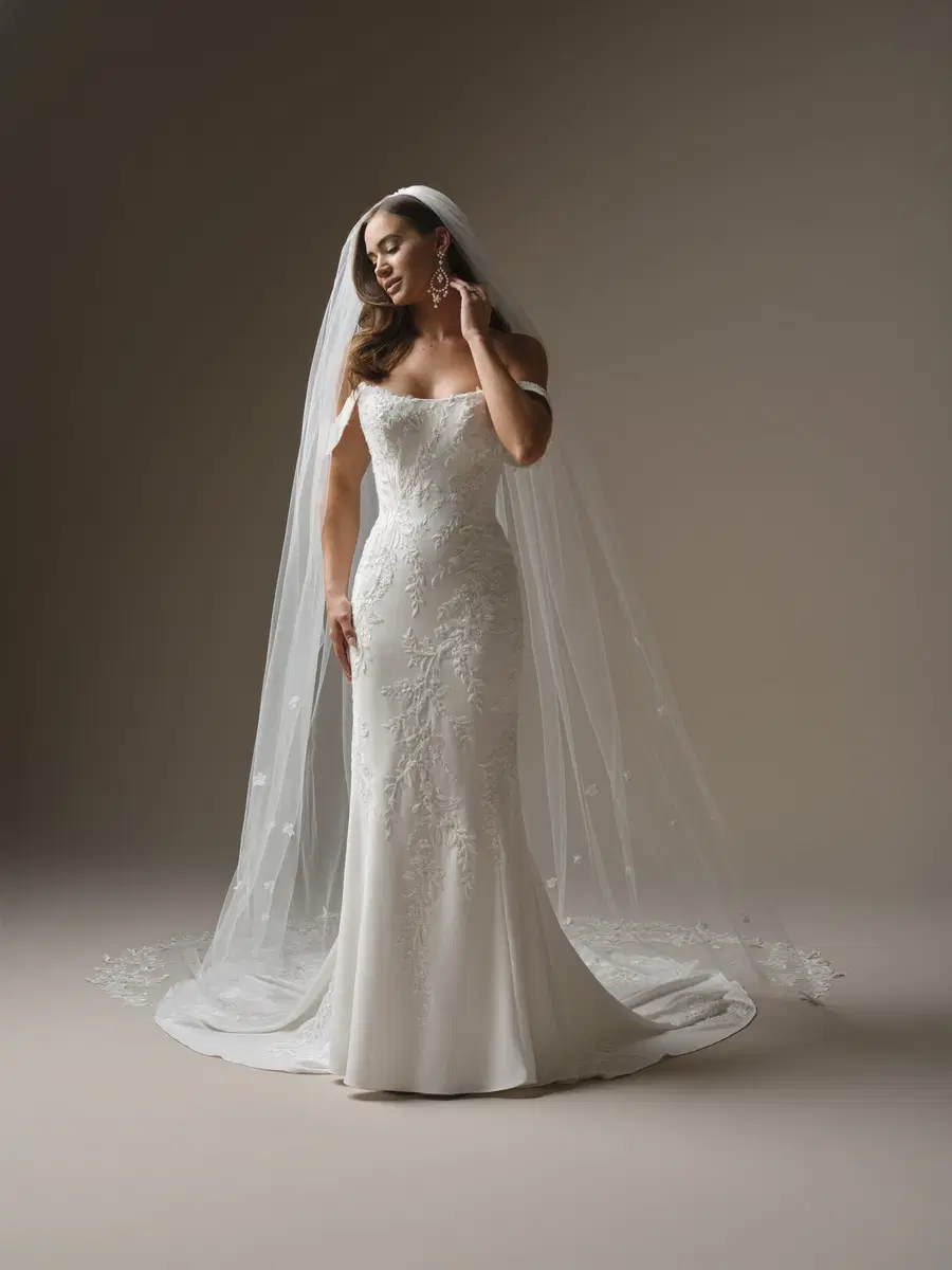 Thera by Maggie Sottero: Fit & Flare silhouette, cat eye neckline, crepe