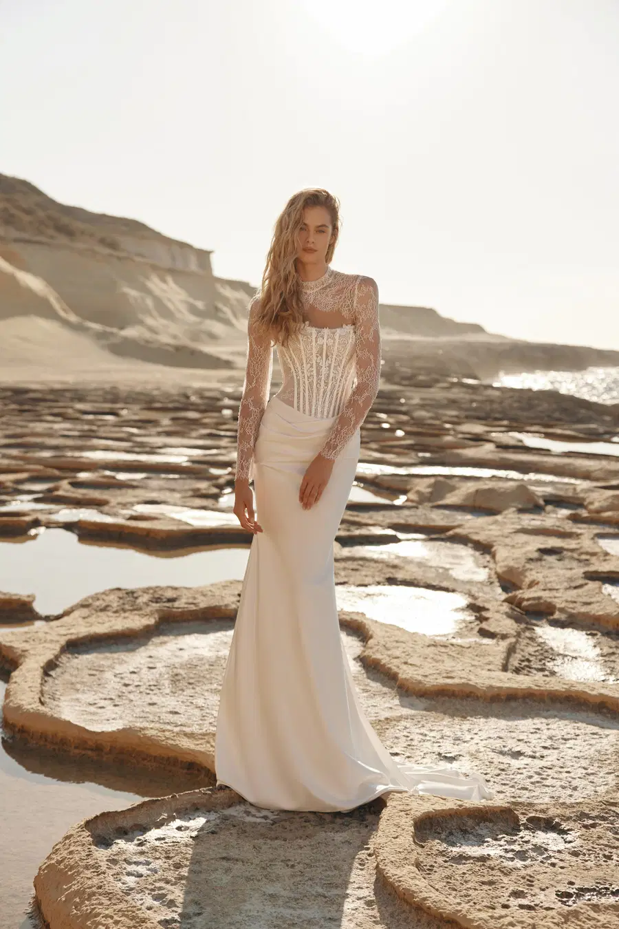 Kilian by Eva Lendel: Trumpet silhouette, high / halter neckline, long sleeves, lace