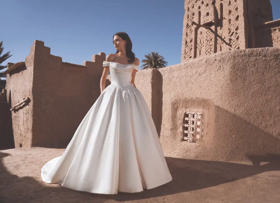 Temina by Enzoani: Ball Gown silhouette, scoop neckline, mikado, cathedral train