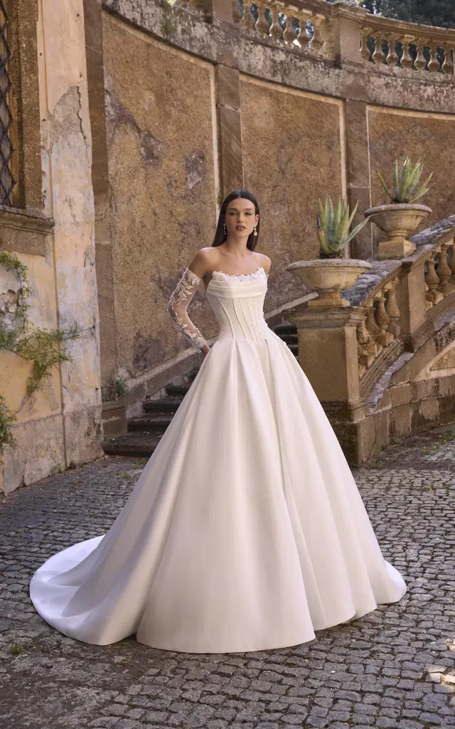 Annie 63228 by Veni Infantino: Ball Gown silhouette, sweetheart neckline, long sleeves, satin