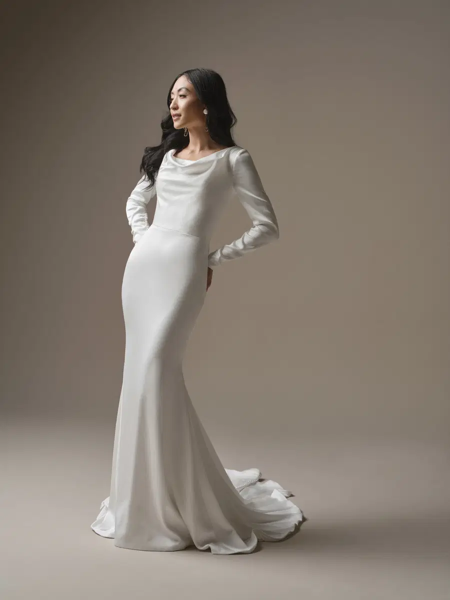 Melinda by Maggie Sottero: Fit & Flare silhouette, scoop neckline, long sleeves, satin