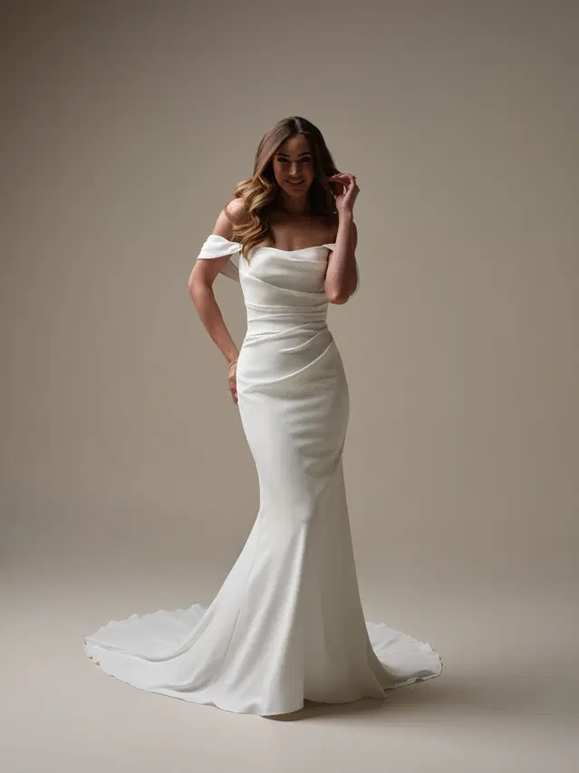 Denise by Rebecca Ingram: Fit & Flare silhouette, cat eye neckline, sleeveless, crepe