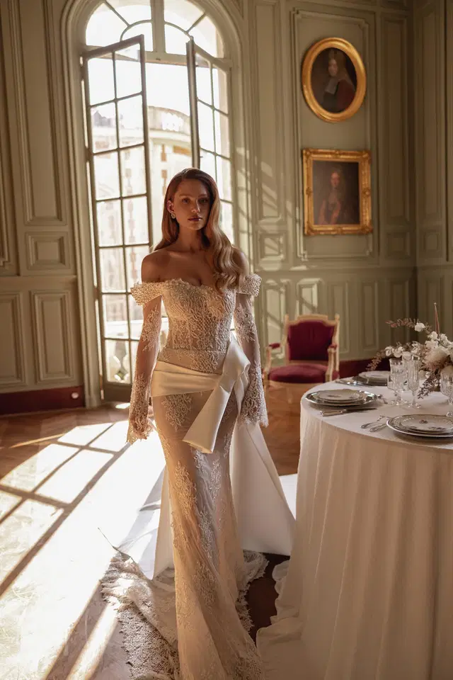 Neema by Maks Mariano: Mermaid silhouette, sweetheart neckline, long sleeves, satin