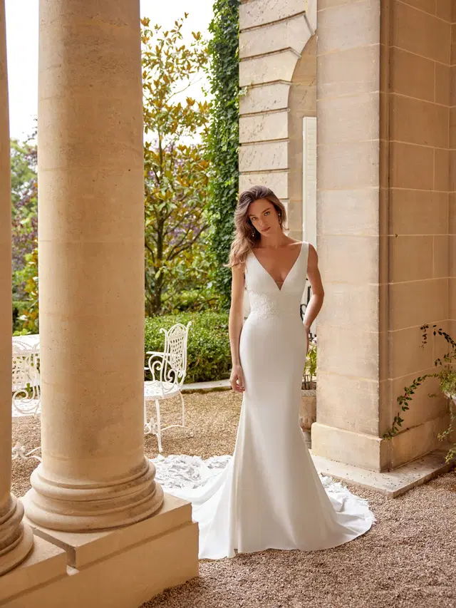 Maverick by Justin Alexander: Trumpet silhouette, deep V-neck neckline, sleeveless, lace