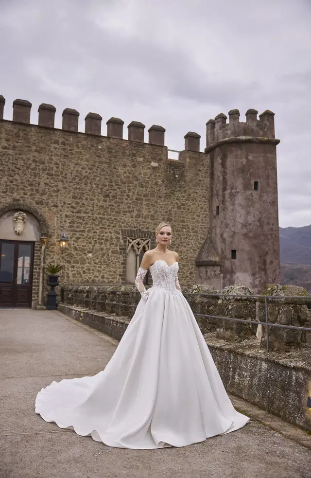Alma 63339 by Veni Infantino: Ball Gown silhouette, sweetheart neckline, long sleeves, lace