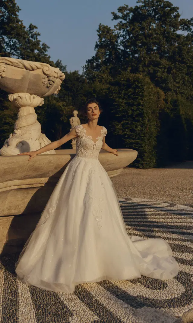 Diyana 24-027(2) by Love by Ricca Sposa: Ball Gown silhouette, illusion neckline, cap sleeves, tulle
