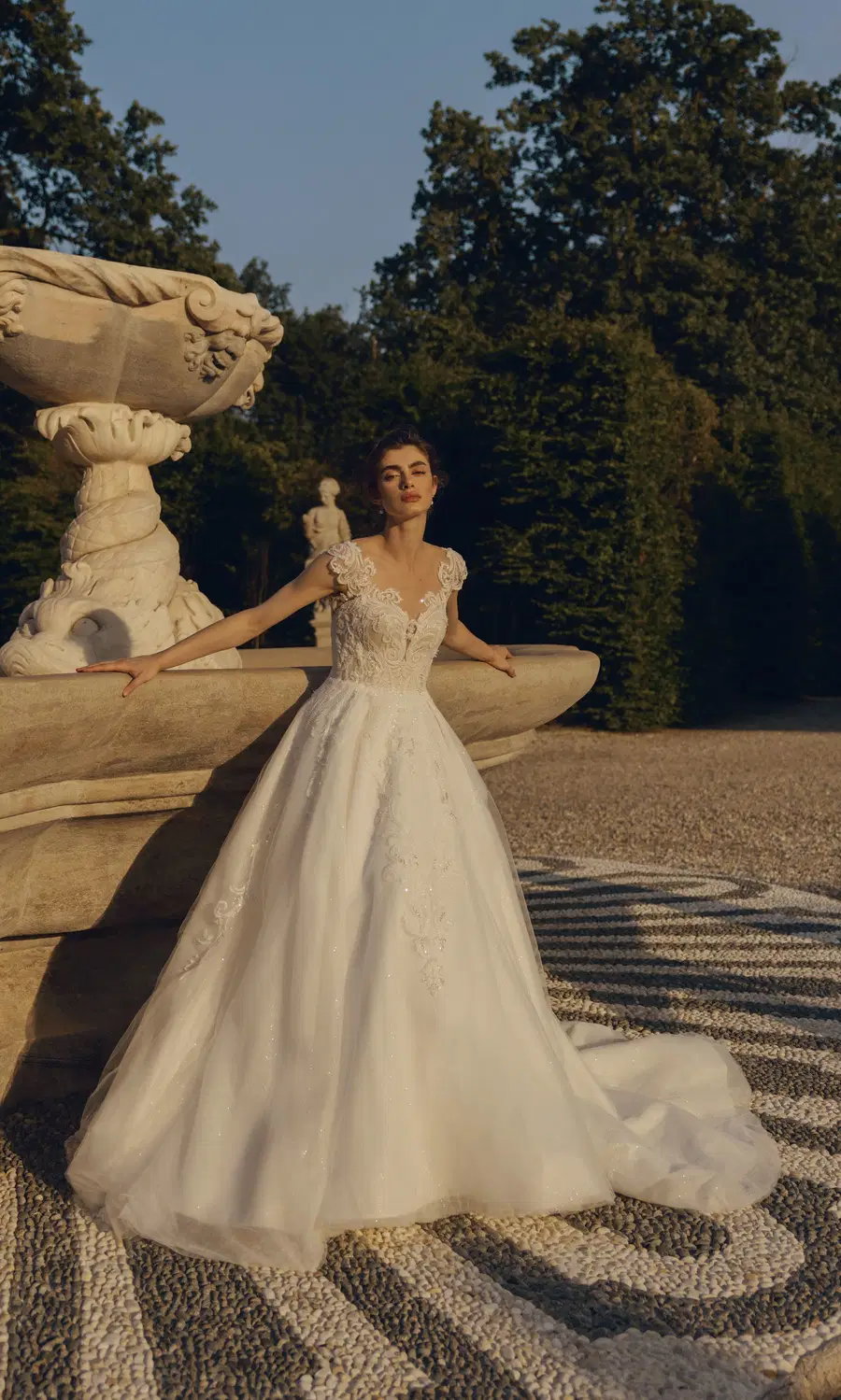 Diyana 24-027(2) by Love by Ricca Sposa: Ball Gown silhouette, illusion neckline, cap sleeves, tulle